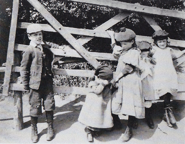 Hoby children at original village gate